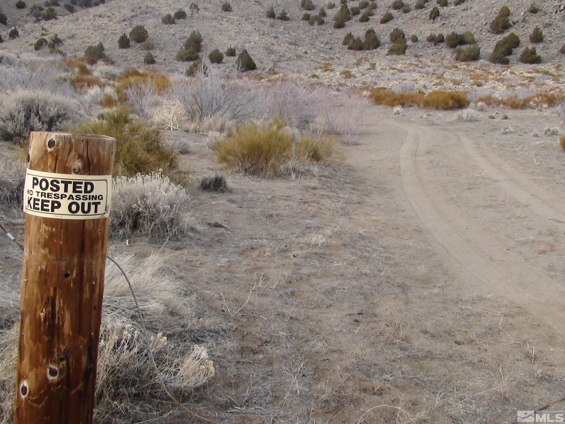 1265 Freds Mountain Road Reno, NV 89508 - Photo 3 of 40 a sign that is on the side of a road