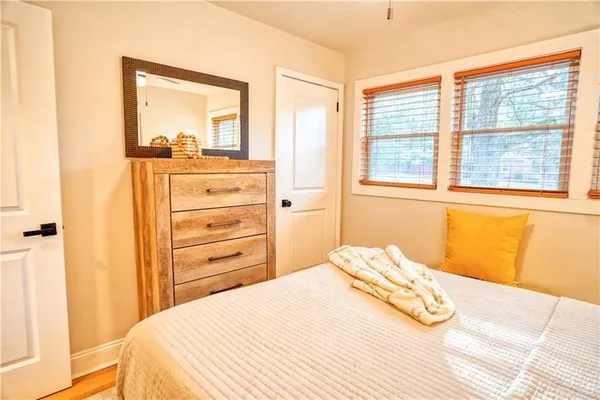 a bedroom with a bed and a dresser