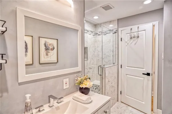 a bathroom with a toilet shower and a window