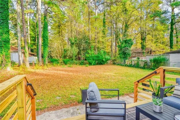 a view of swimming pool with a patio