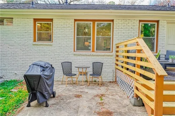 a view of a two chairs in the balcony