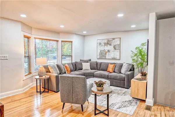 a living room with furniture and a large window