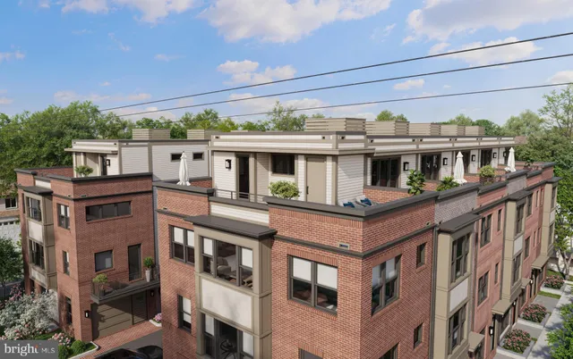 a view of a house with a yard and balcony