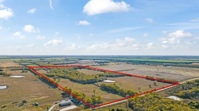 a view of a swimming pool and an outdoor seating