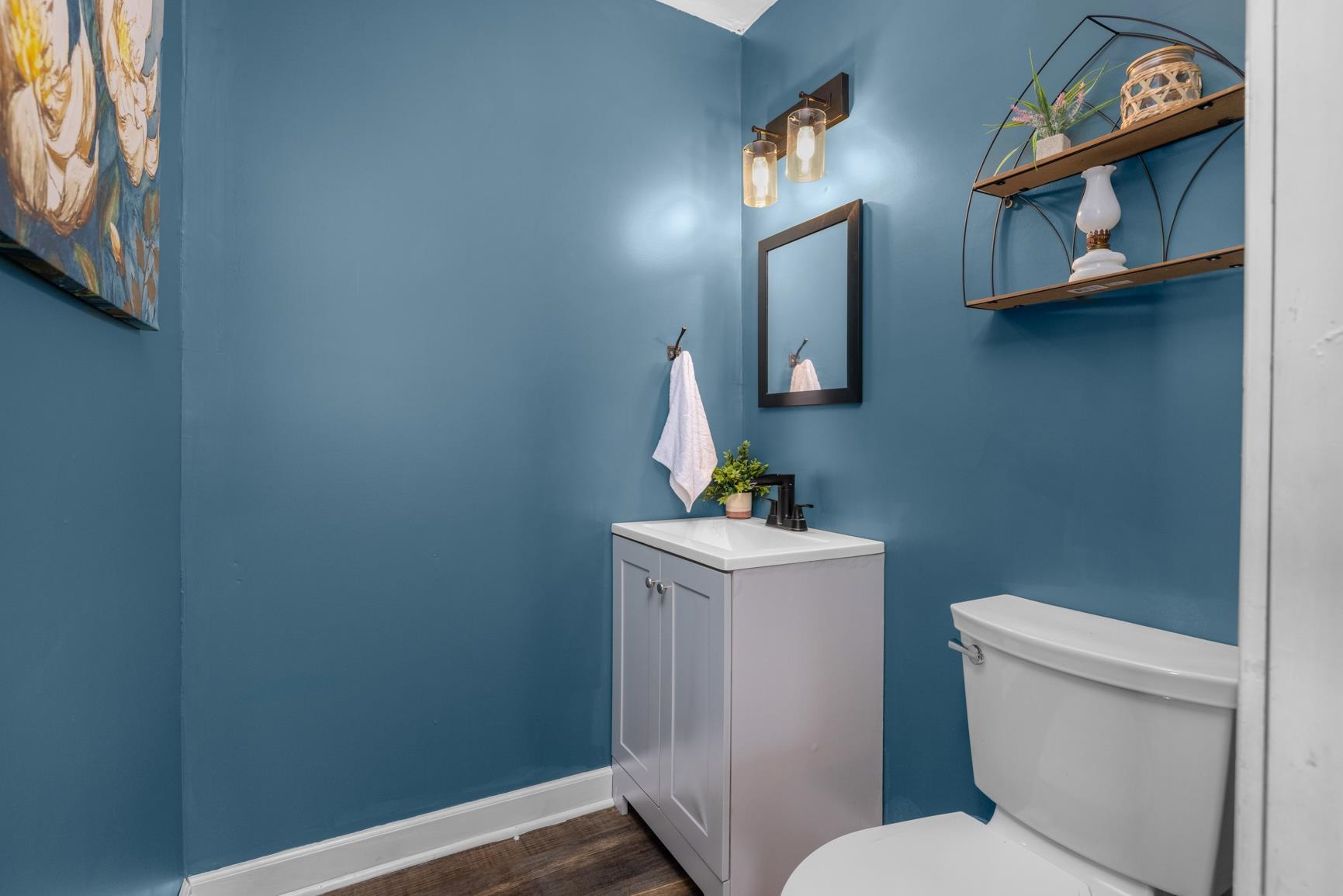 420 Sanford Road Covington, TN 38019 - Photo 17 of 27 Gray vanity with a white countertop and a matte black faucet