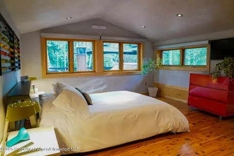 a bathroom with a sink a bathtub and next to a window