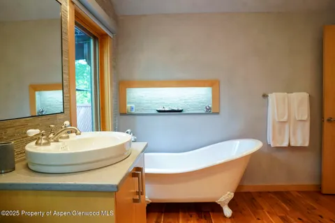 a view of a chairs and table in the yard