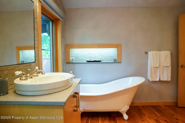 a view of a chairs and table in the yard