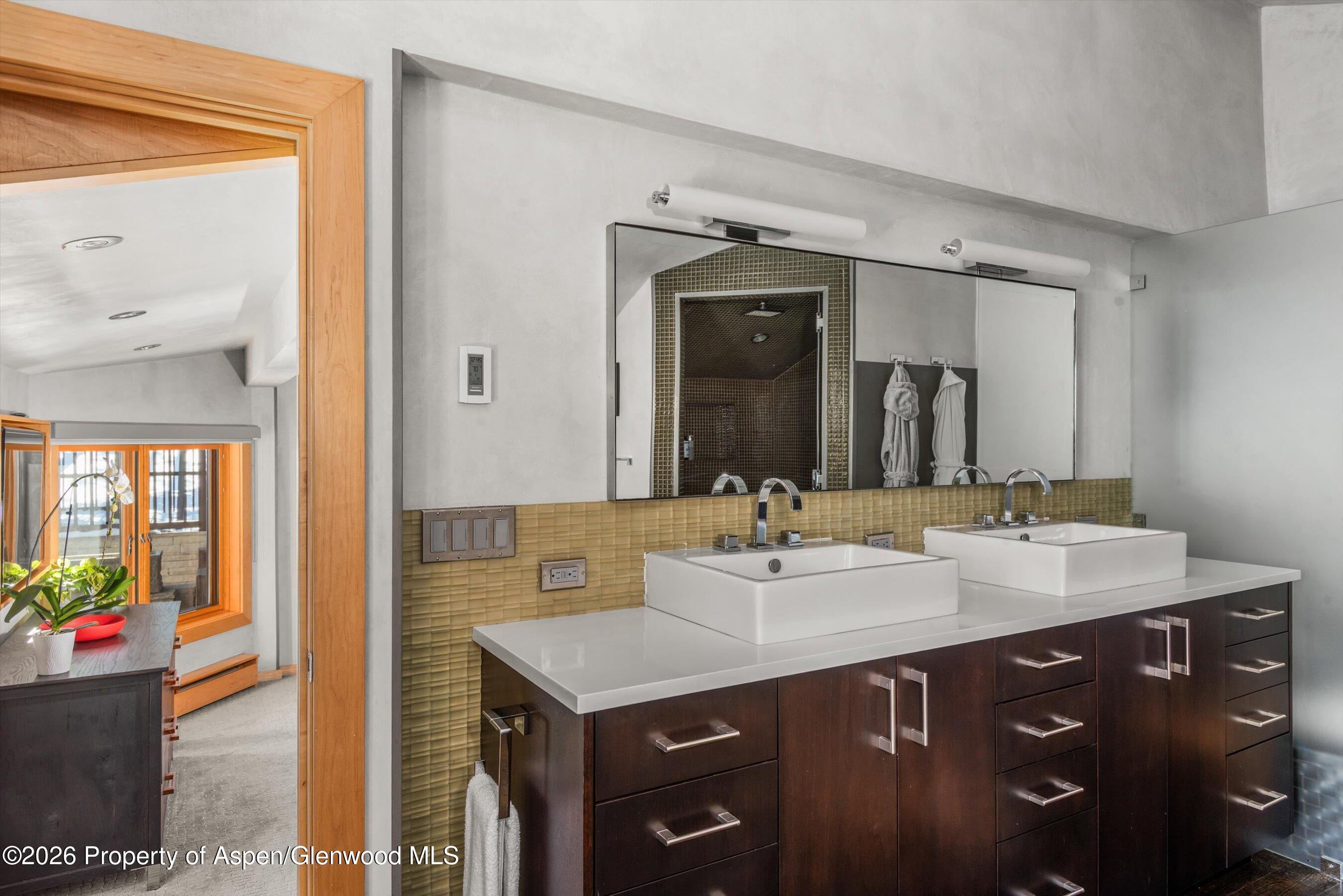 1038 Owl Creek Road Aspen, CO 81611 - Photo 20 of 44 a bathroom with a sink double vanity and a mirror