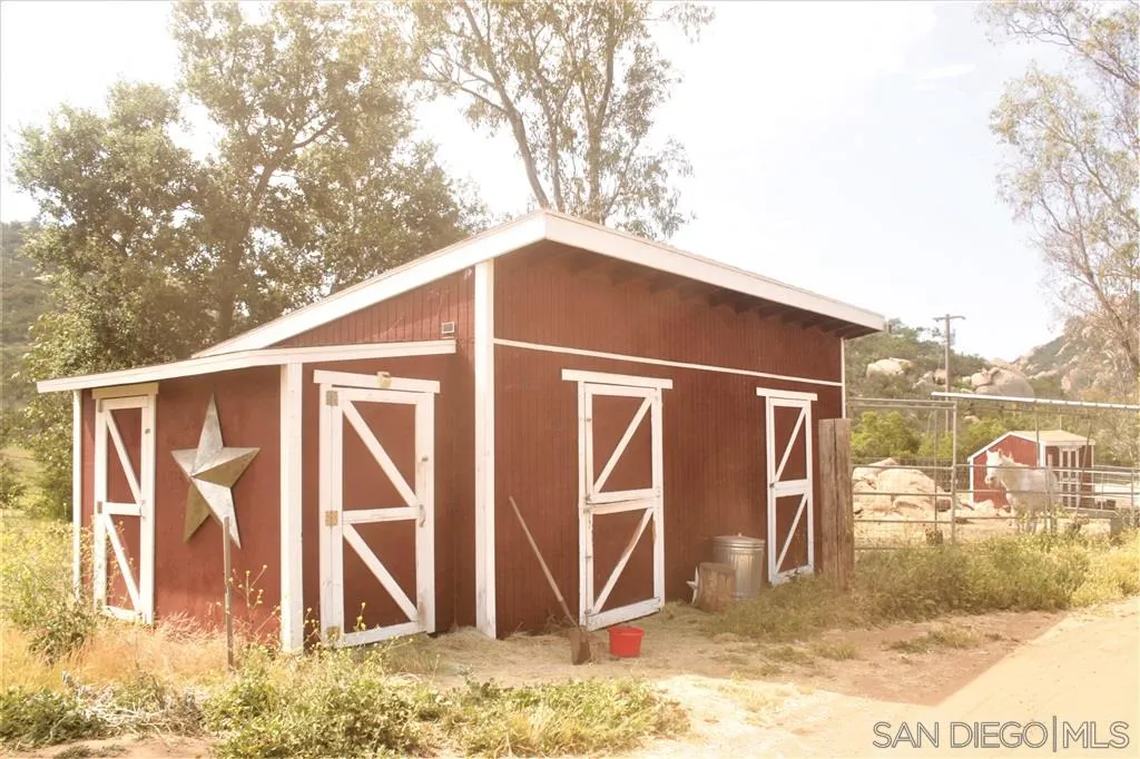 17315 Lyons Creek Road Jamul, CA 91935 - Photo 13 of 25 a backyard of a house with table and chairs