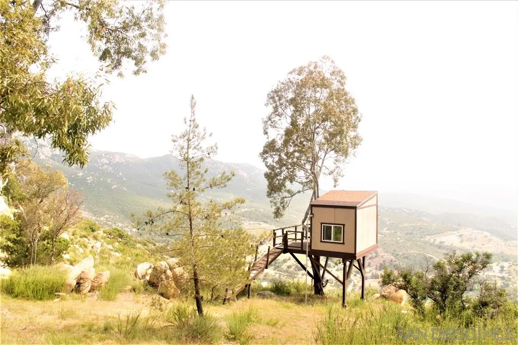 17315 Lyons Creek Road Jamul, CA 91935 - Photo 20 of 25 a balcony with table and chairs