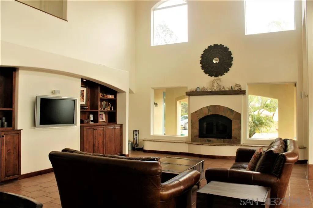 17315 Lyons Creek Road Jamul, CA 91935 - Photo 2 of 25 a living room with furniture and a fireplace