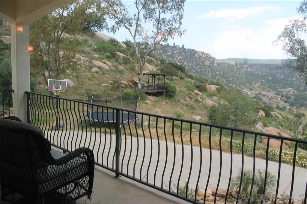 17315 Lyons Creek Road Jamul, CA 91935 - Photo 25 of 25 a balcony with trees in front of it