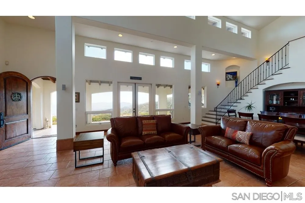 17315 Lyons Creek Road Jamul, CA 91935 - Photo 3 of 25 a living room with furniture and a fireplace