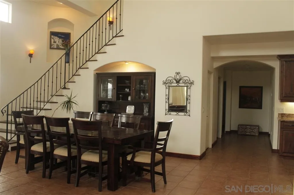 17315 Lyons Creek Road Jamul, CA 91935 - Photo 4 of 25 a view of a dining room with furniture and wooden floor