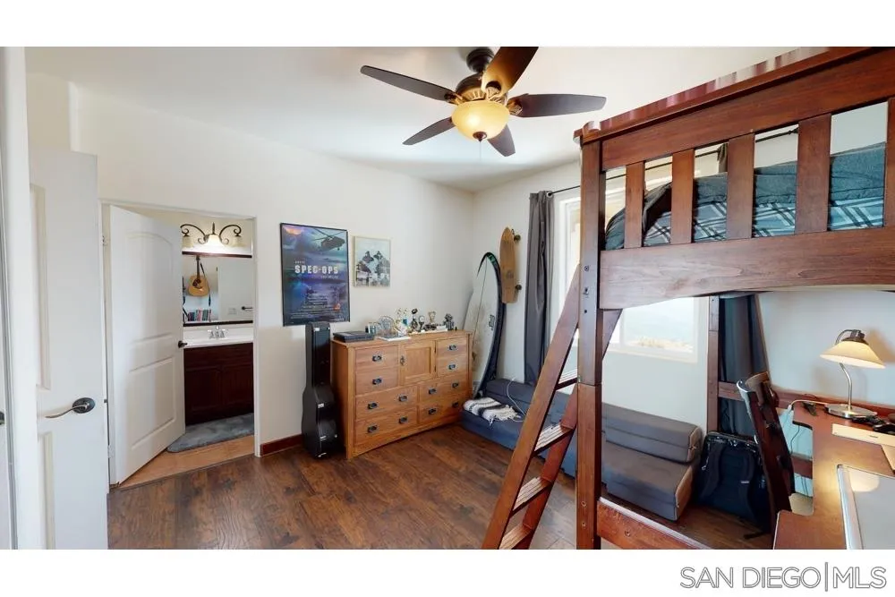 17315 Lyons Creek Road Jamul, CA 91935 - Photo 10 of 25 a living room with furniture and a floor to ceiling window