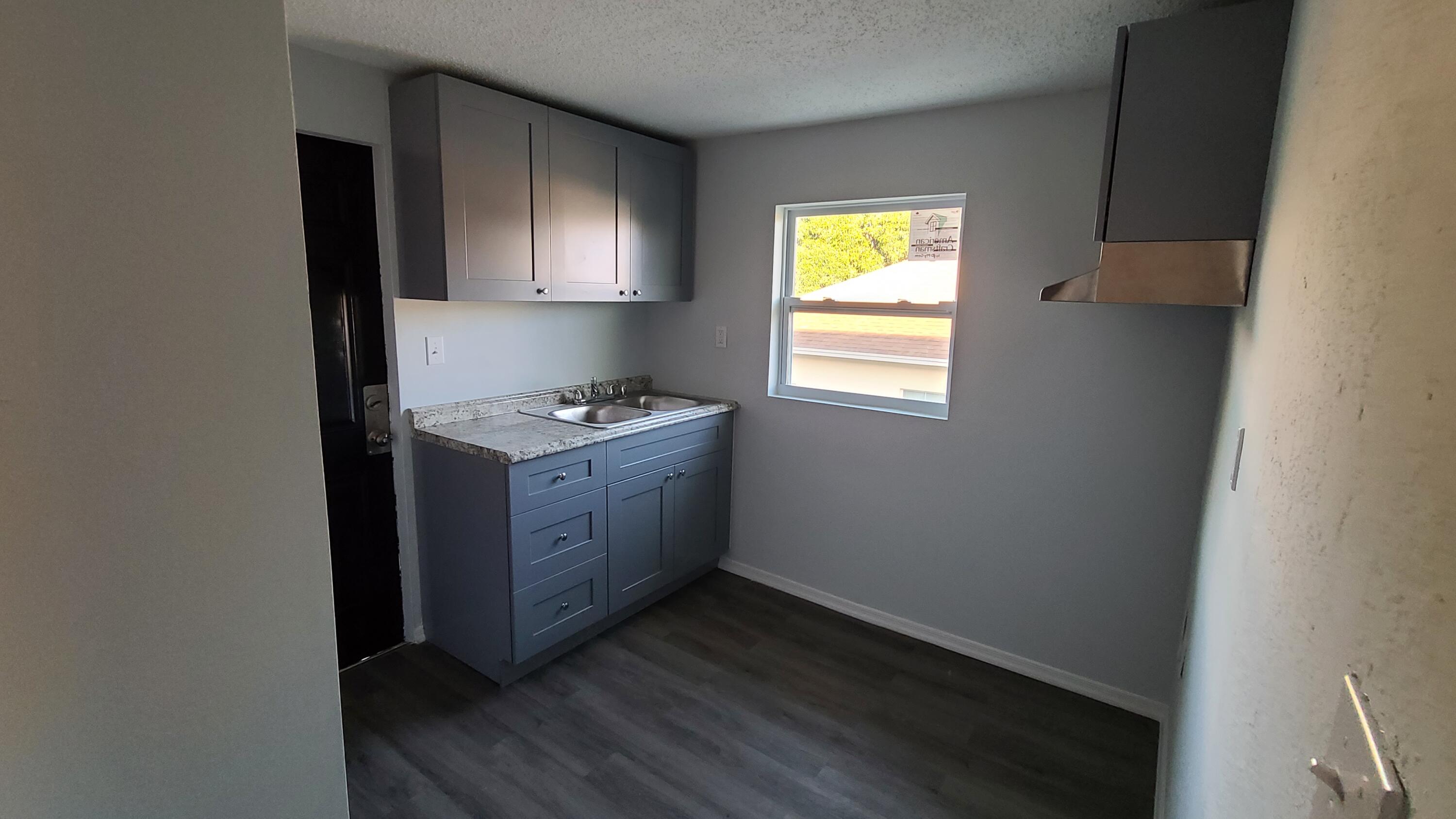 921 14th Street West Palm Beach, FL 33401 - Photo 13 of 36 a room with window and dresser