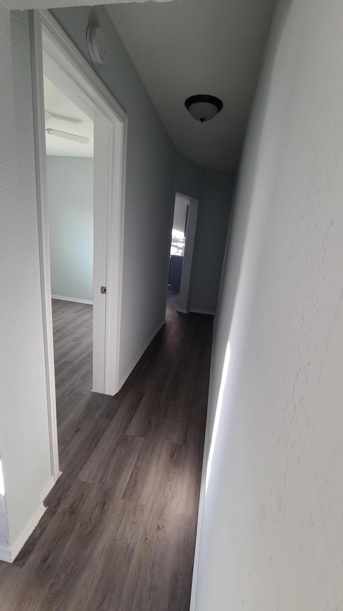 921 14th Street West Palm Beach, FL 33401 - Photo 23 of 36 a view of a hallway with wooden floor