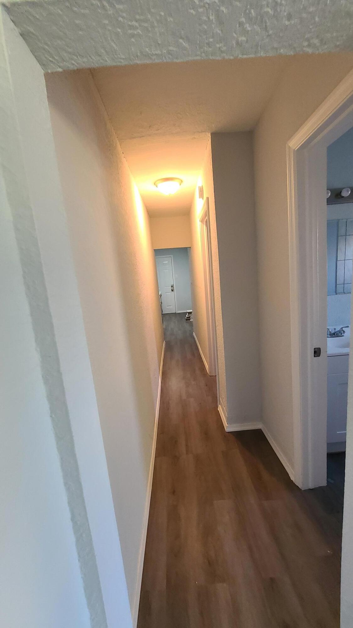 921 14th Street West Palm Beach, FL 33401 - Photo 25 of 36 a view of a hallway with wooden floor