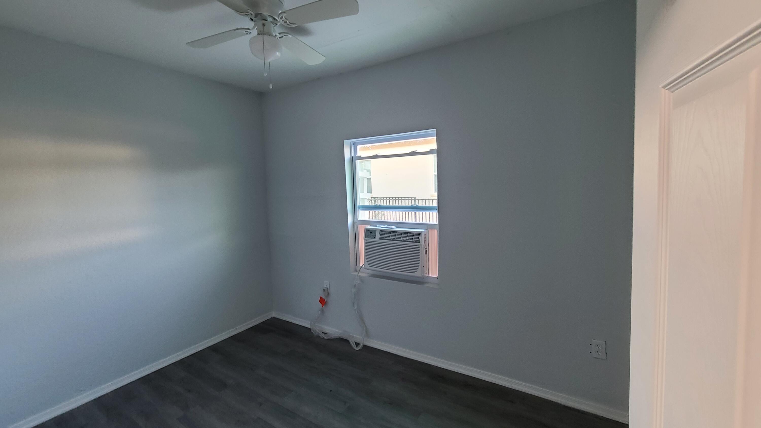 921 14th Street West Palm Beach, FL 33401 - Photo 27 of 36 an empty room with a window and a fan