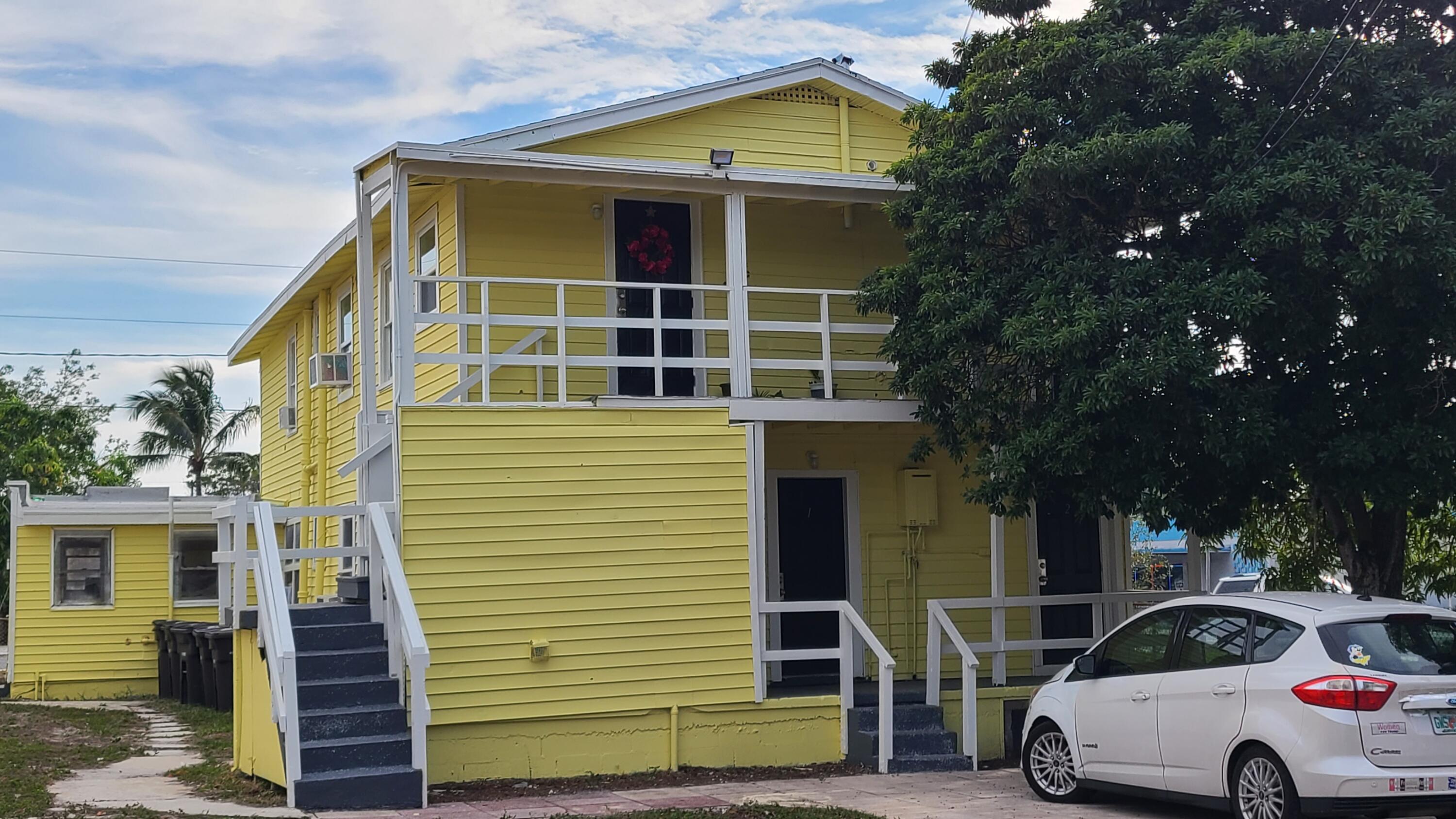 921 14th Street West Palm Beach, FL 33401 - Photo 3 of 36 a car parked in front of a house