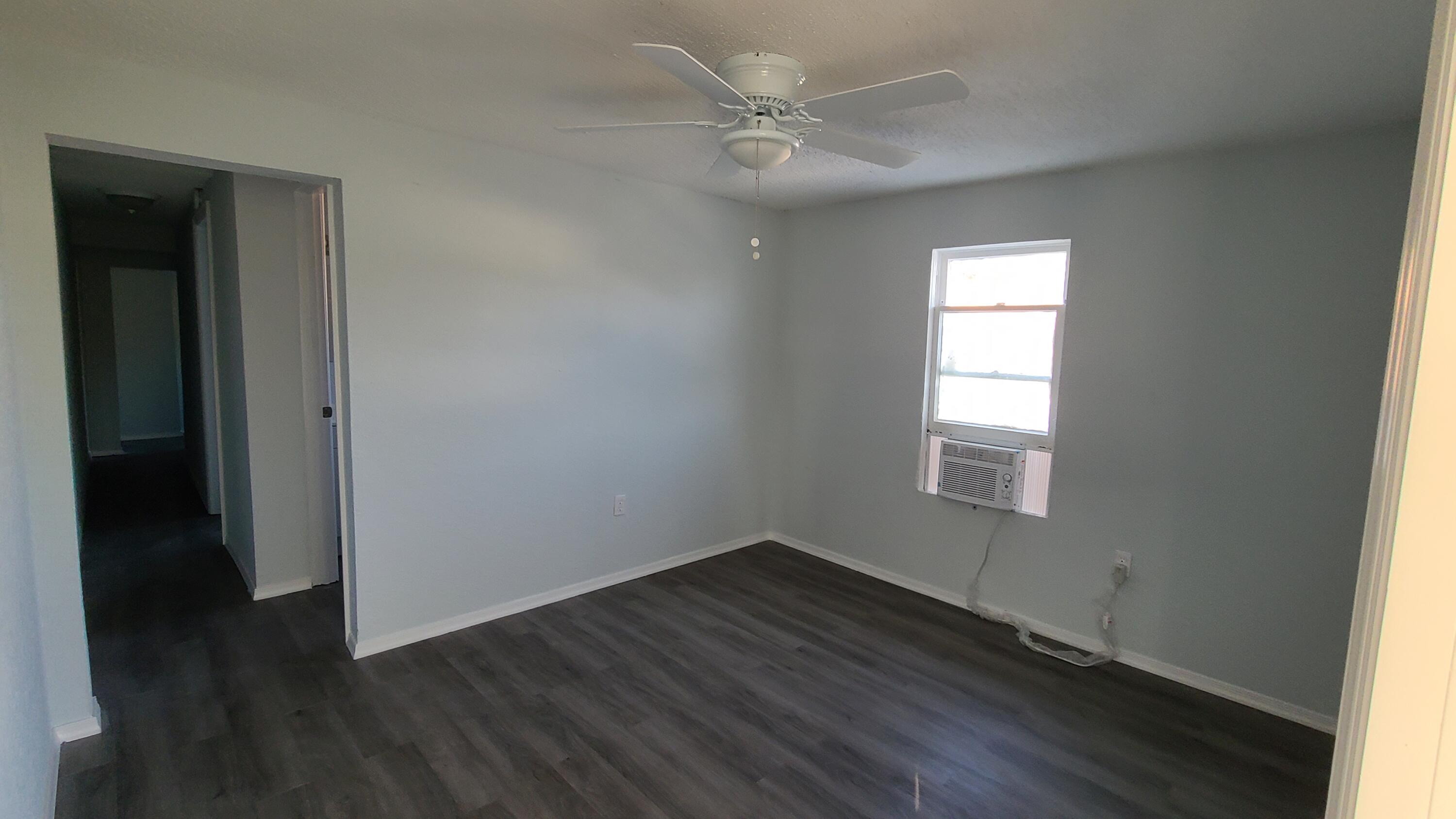921 14th Street West Palm Beach, FL 33401 - Photo 32 of 36 an empty room with wooden floor closet and windows