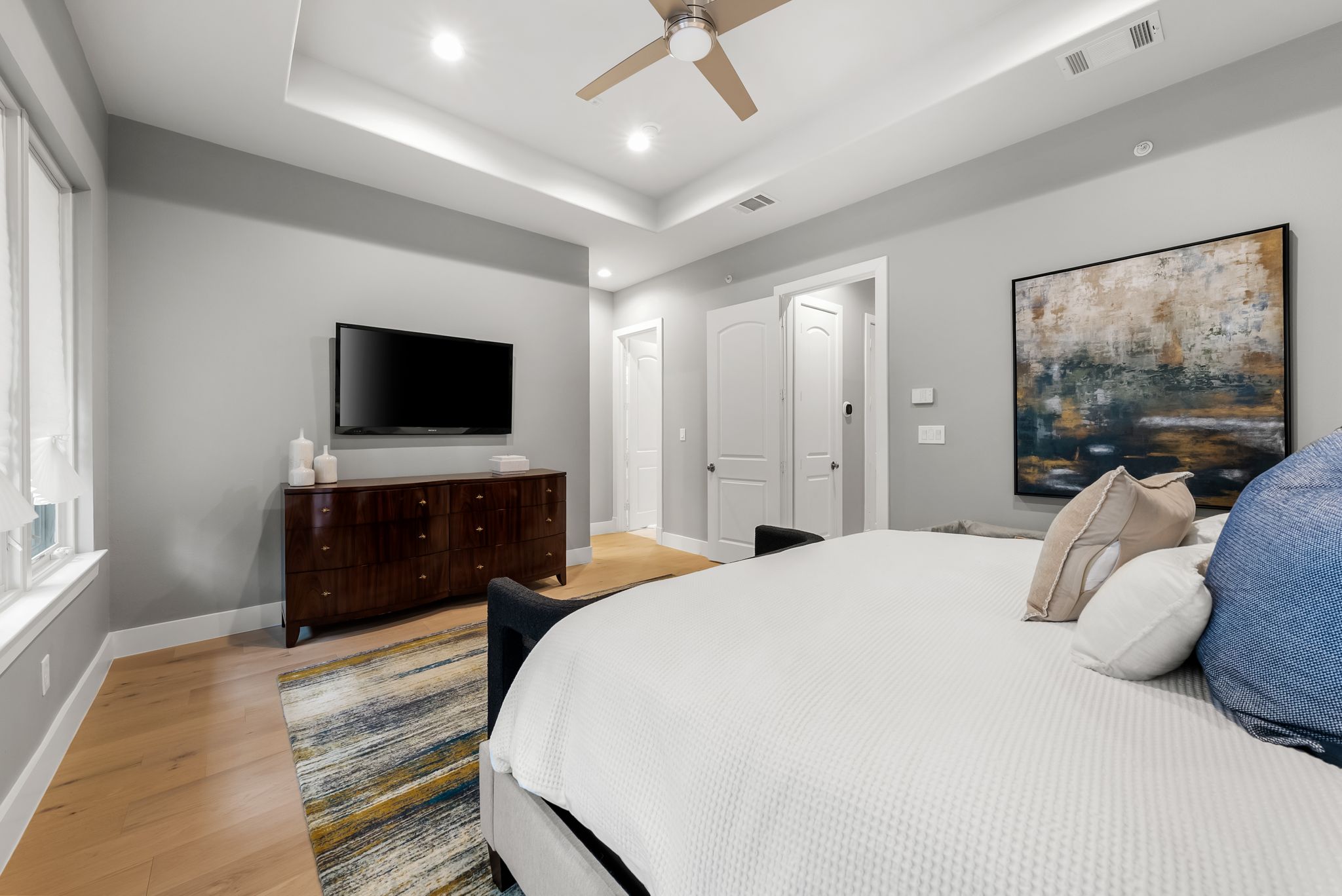 1529 Barton Springs Road, Unit 13 Austin, TX 78704 - Photo 16 of 35 a bedroom with a bed and a flat screen tv