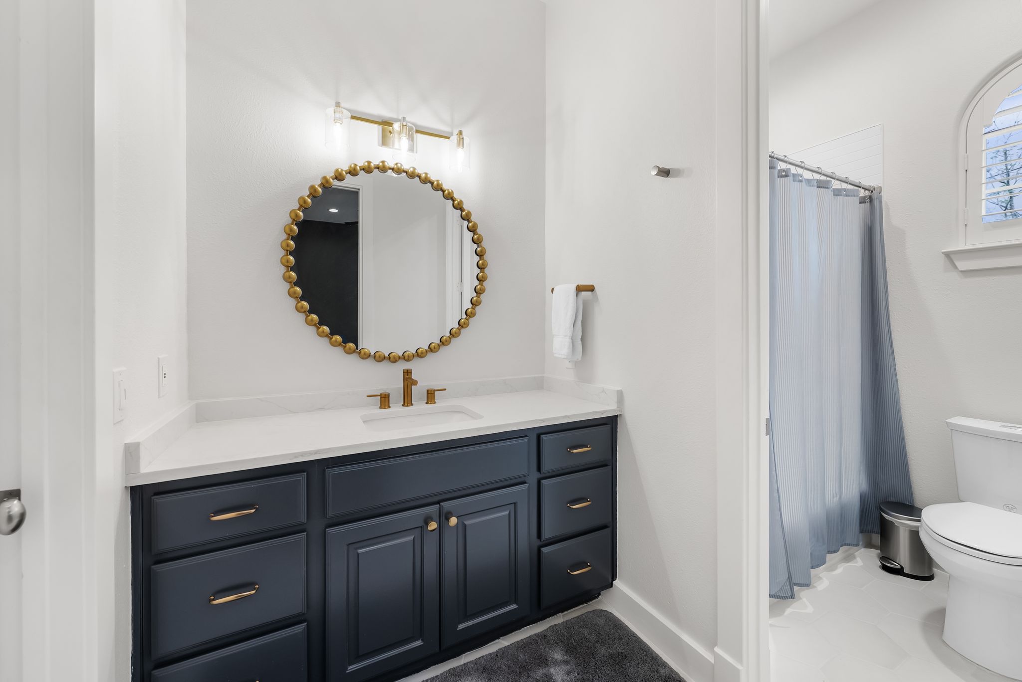 1529 Barton Springs Road, Unit 13 Austin, TX 78704 - Photo 22 of 35 a bathroom with a toilet sink and mirror