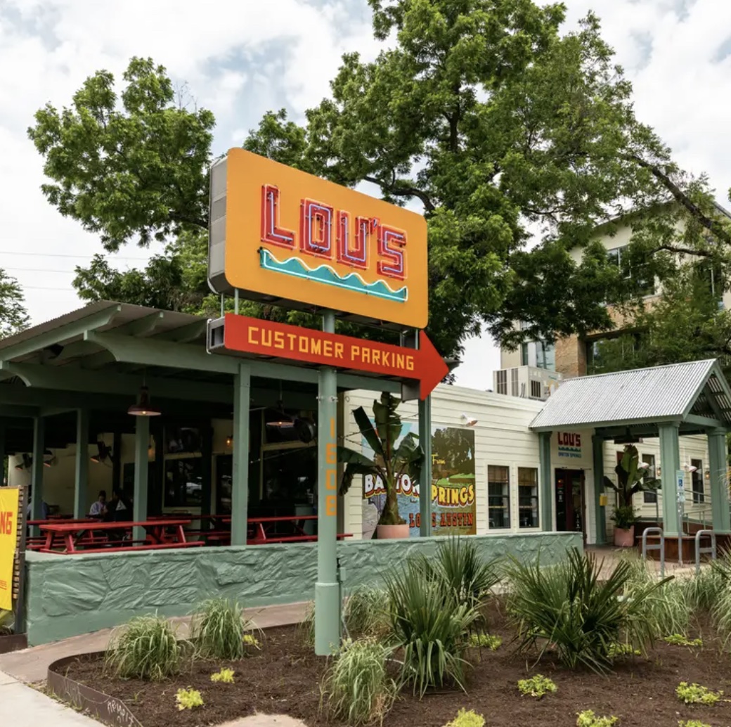 1529 Barton Springs Road, Unit 13 Austin, TX 78704 - Photo 32 of 35 a view of a building with a garden
