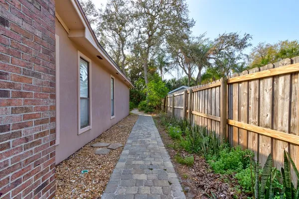 a view of a pathway with a backyard
