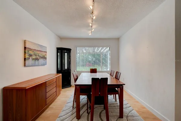 a view of a dining room with furniture window and outside view