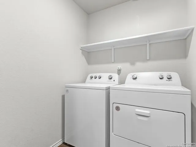 a utility room with dryer and washer