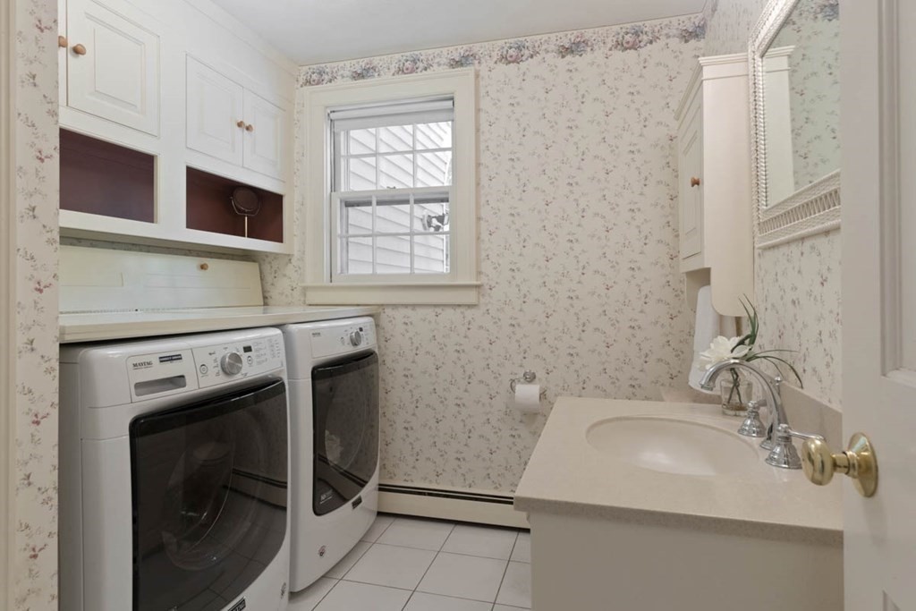 28 Gunnison Road Boxford, MA 01921 - Photo 19 of 37 a bathroom with a sink a washer and dryer