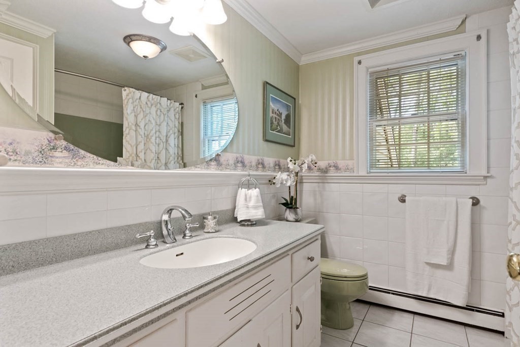28 Gunnison Road Boxford, MA 01921 - Photo 24 of 37 a bathroom with a sink toilet and mirror