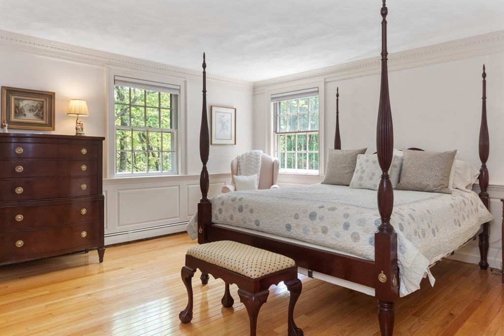 28 Gunnison Road Boxford, MA 01921 - Photo 25 of 37 a bedroom with a bed and a dresser next to a window