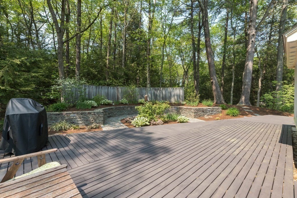 28 Gunnison Road Boxford, MA 01921 - Photo 32 of 37 a view of a wooden floor with a bench