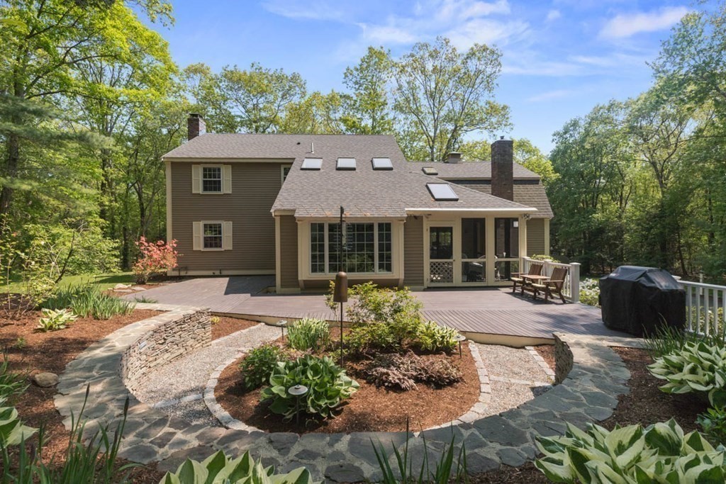 28 Gunnison Road Boxford, MA 01921 - Photo 34 of 37 front view of a house with a yard