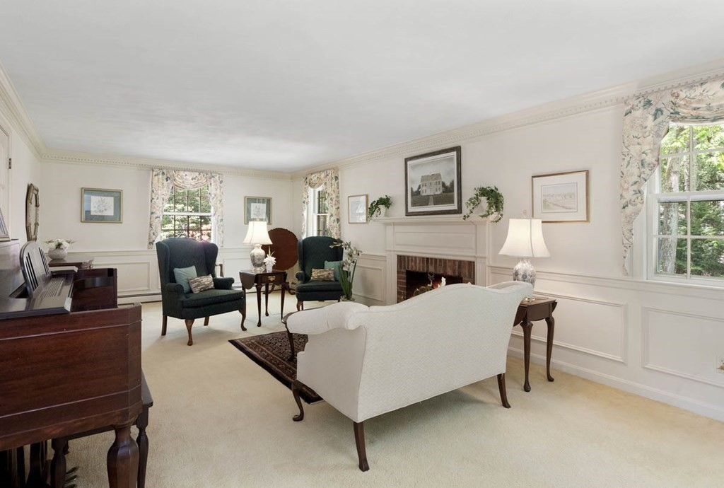 28 Gunnison Road Boxford, MA 01921 - Photo 4 of 37 a living room with furniture and a fireplace