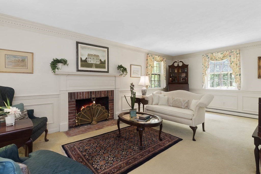 28 Gunnison Road Boxford, MA 01921 - Photo 6 of 37 a living room with furniture and a fireplace
