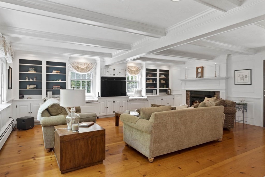 28 Gunnison Road Boxford, MA 01921 - Photo 10 of 37 a living room with furniture and a flat screen tv