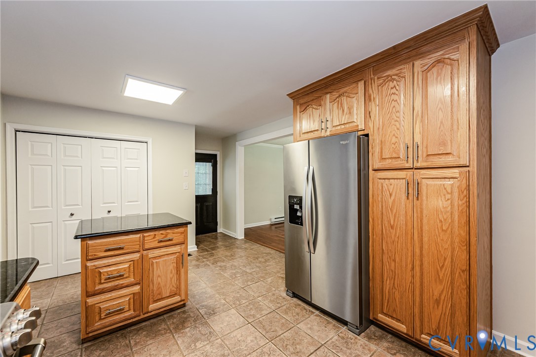 16110 Rowlett Road Chesterfield, VA 23838 - Photo 14 of 23 Kitchen featuring an island with granite counterto