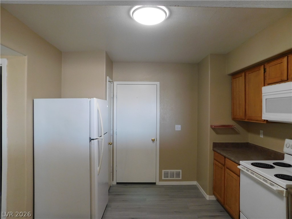 7255 West Sunset Road, Unit 2029 Las Vegas, NV 89113 - Photo 7 of 21 Functional kitchen with ample cabinetry and essential appliances.