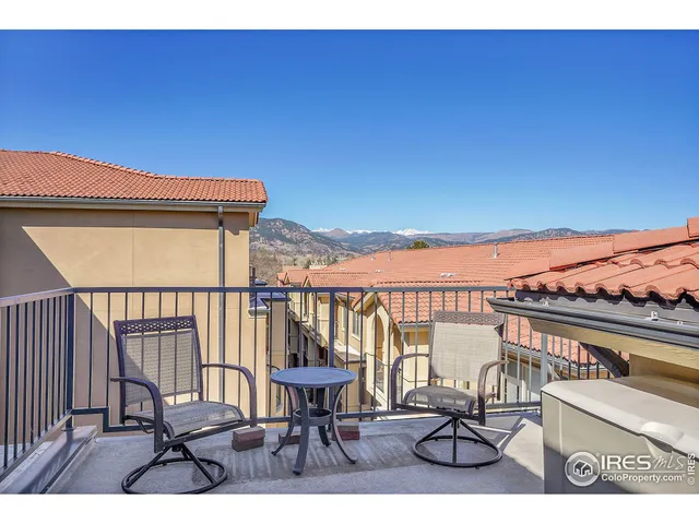 a view of bedroom with cabinet and mirror