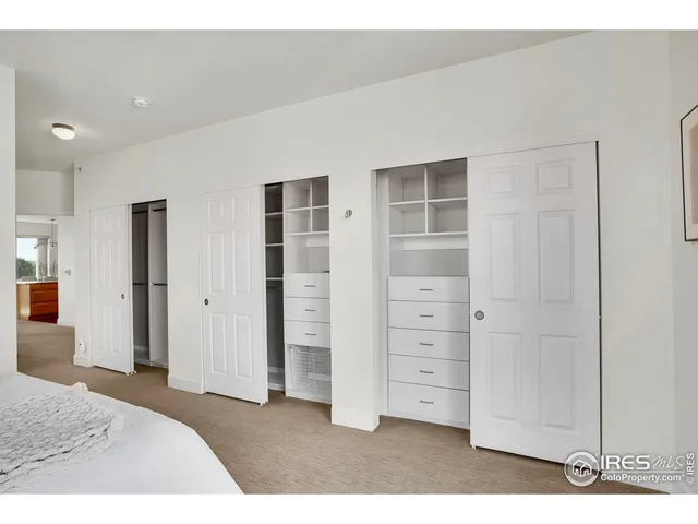 a bathroom with a granite countertop sink mirror and shower