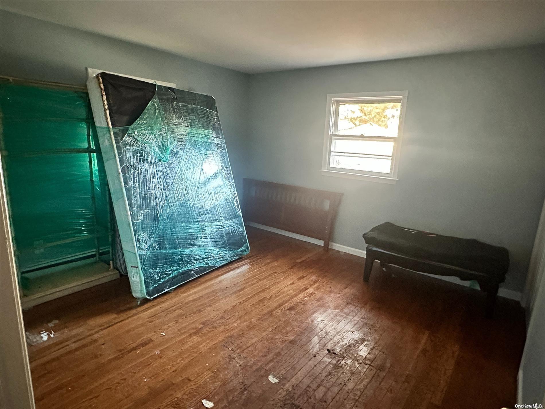 68 Tarpon Road Rocky Point, NY 11778 - Photo 12 of 23 a view of a room with furniture and a gate