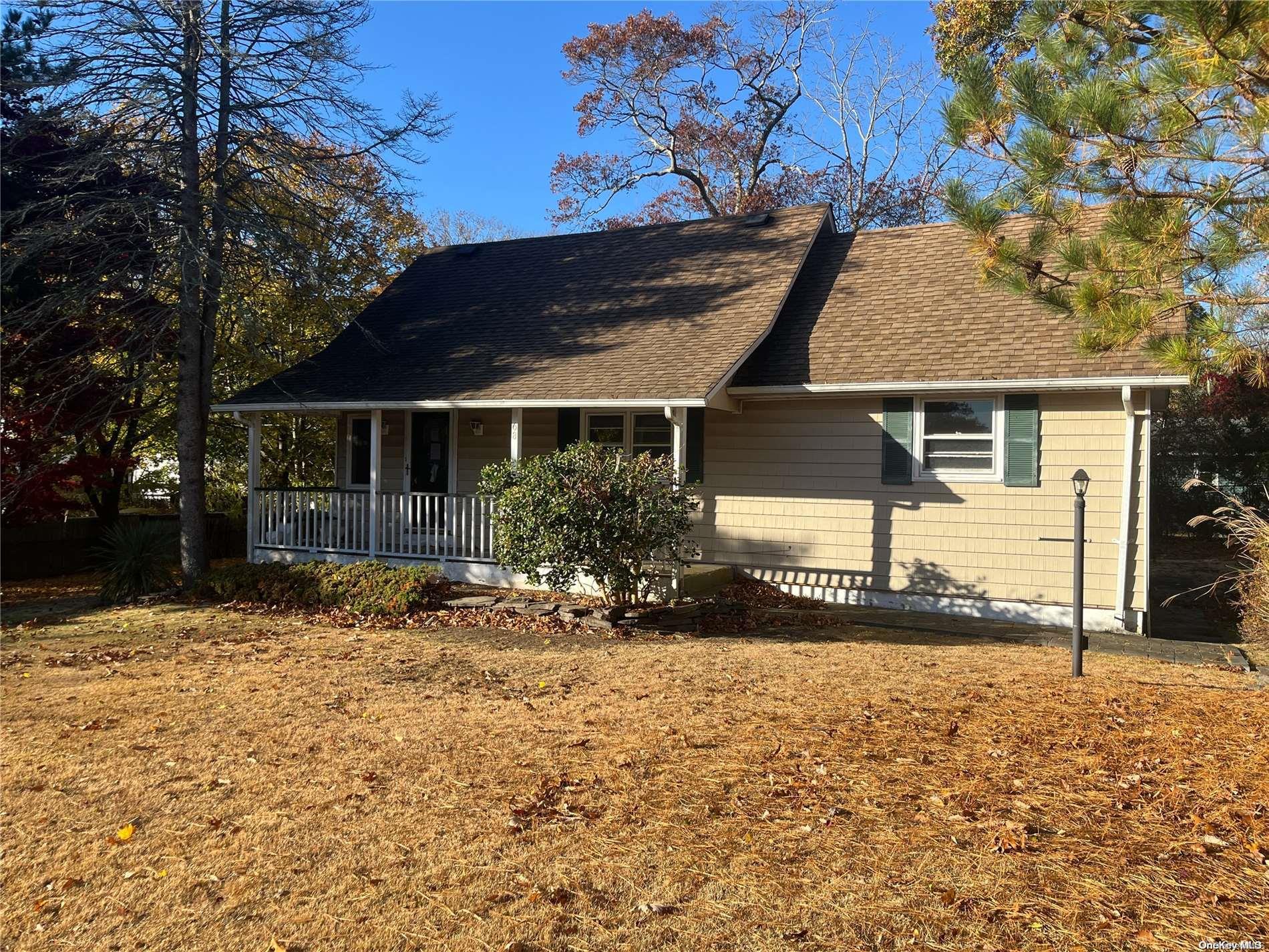 68 Tarpon Road Rocky Point, NY 11778 - Photo 18 of 23 front view of house with a yard