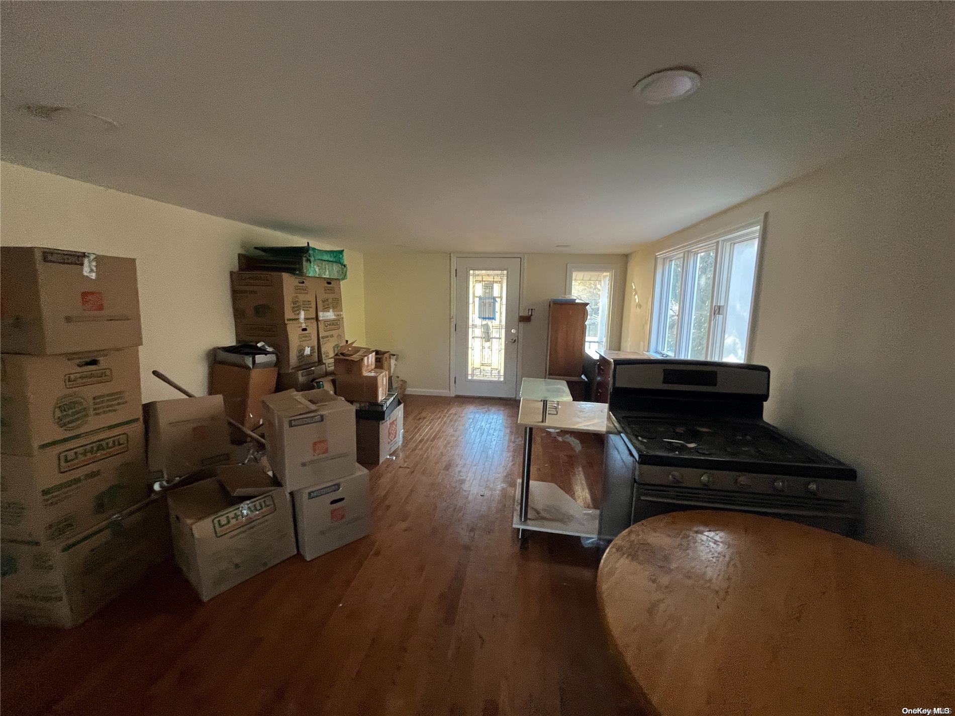 68 Tarpon Road Rocky Point, NY 11778 - Photo 20 of 23 a living room with furniture and a chandelier