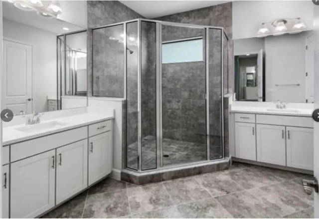 a view of a kitchen with refrigerator and a counter top space