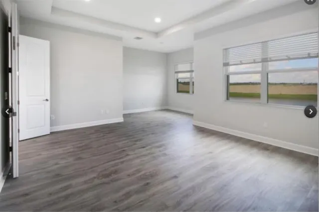 a view of a kitchen with a sink and a large window