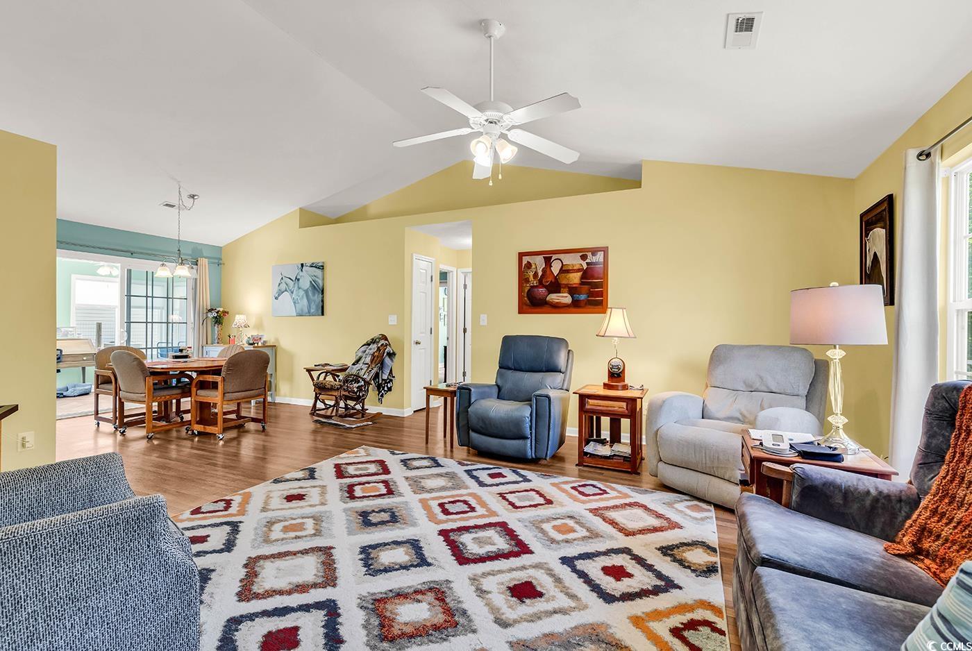 454 Sean River Road Conway, SC 29526 - Photo 12 of 38 Living room featuring lofted ceiling, wood finished floors, ceiling fan, and baseboards